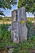 Spain, Galicia. Stone carving of a pilgrim along the Camino de between Ventras de Naron and Palas de Rei
