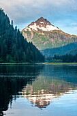 USA, Alaska, Tongass National Forest. Mountain and forest reflections on Red Bluff Bay.