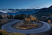 USA, Colorado, Uncompahgre National Forest. Mountain landscape and highway switchback.