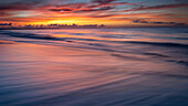 USA, New Jersey, Cape May National Seashore. Sunrise on ocean shore.