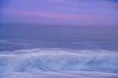 USA, New Jersey, Cape May National Seashore. Abstract of beach wave at sunrise.