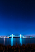 USA, New York, Tarrytown. Stars over the Hudson River and the Gov. Mario Cuomo (Tappan Zee) Bridge