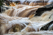 USA, West Virginia, Blackwater Falls State Park. Blackwater Falls and rapids.
