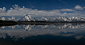 USA, Wyoming. Panoramic landscape of Teton Mountains reflected in Jackson Lake in springtime