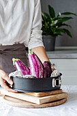 Crop anonymous person preparing vegetable for cooking healthy lunch in kitchen