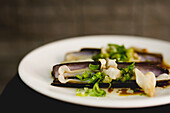 Dish with delectable razor clams in restaurant