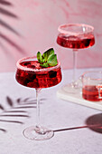Strawberry cocktail with mint and sugar rim