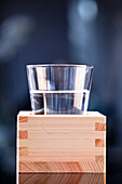 Sake in a glass on a traditional wooden box