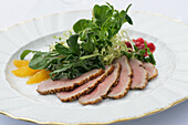 Duck breast fillet with salad and orange