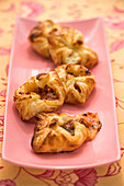 Puff pastry pockets with salami and trout