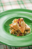 Salmon trout on vegetable barley with lovage sauce