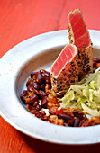 Fried tuna with kidney beans and salad
