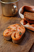 Grilled salmon steak with toasted bread