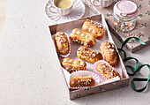 Éclairs with caramel cream and almonds