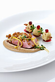 Poached duck with chestnut cream and baked grapes