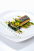 Sea bass with wild asparagus, carrots and spinach