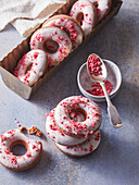 Cocoa donuts with sugar icing and freeze-dried raspberries