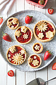 Strawberry tartlets with pastry flowers