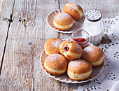 Doughnuts with jam and icing sugar