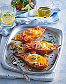 Baked sweet potatoes with cheese, bacon and egg