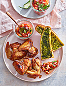Chicken wings with vegetable salsa and herb baguette
