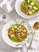Spring soup with herb omelette and vegetables