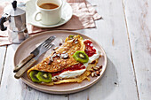 Sweet omelette with ricotta and kiwi