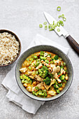 Chicken and coconut curry with vegetables and rice