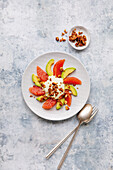 Avocado and grapefruit salad with yoghurt and nuts