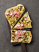 Tarte flambée with leek, radishes and capers