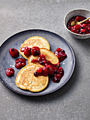 Pancakes with red berry sauce