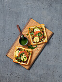 Savoury puff pastry squares with vegetables and cheese