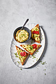 Vegan egg salad on toast with tomatoes and cress