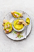 Chickpea curry spread with radishes