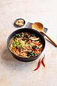 Miso noodle soup with vegetables and sesame seeds