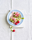 Avocado and egg salad with radishes on wholemeal bread