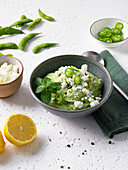 Green smoothie bowl with feta