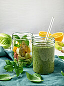 Green smoothie with basil and fruit