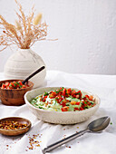 Guacamole smoothie bowl with tomato salsa