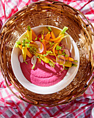 Beetroot hummus with carrots and radishes