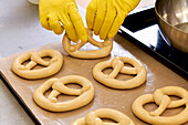 Place the pretzel dough pieces on a baking tray