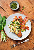 Croissant with wild garlic scrambled eggs and bacon