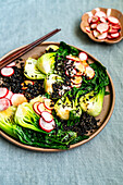 Pak choi salad with pickled radishes and black quinoa