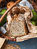 Loaf of bread with grains in a wicker basket