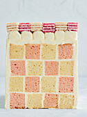 Chessboard cake with vanilla and strawberry wafers