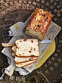 Raisin bread cut into slices on a wooden board