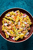 Pasta salad with smoked salmon and radishes