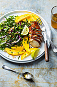 Chicken breast with salad, mango and cashew nuts