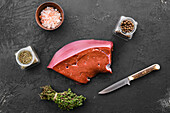 Raw beef liver with spices and herbs