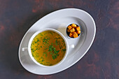 Chicken bouillon with fresh herbs and croutons